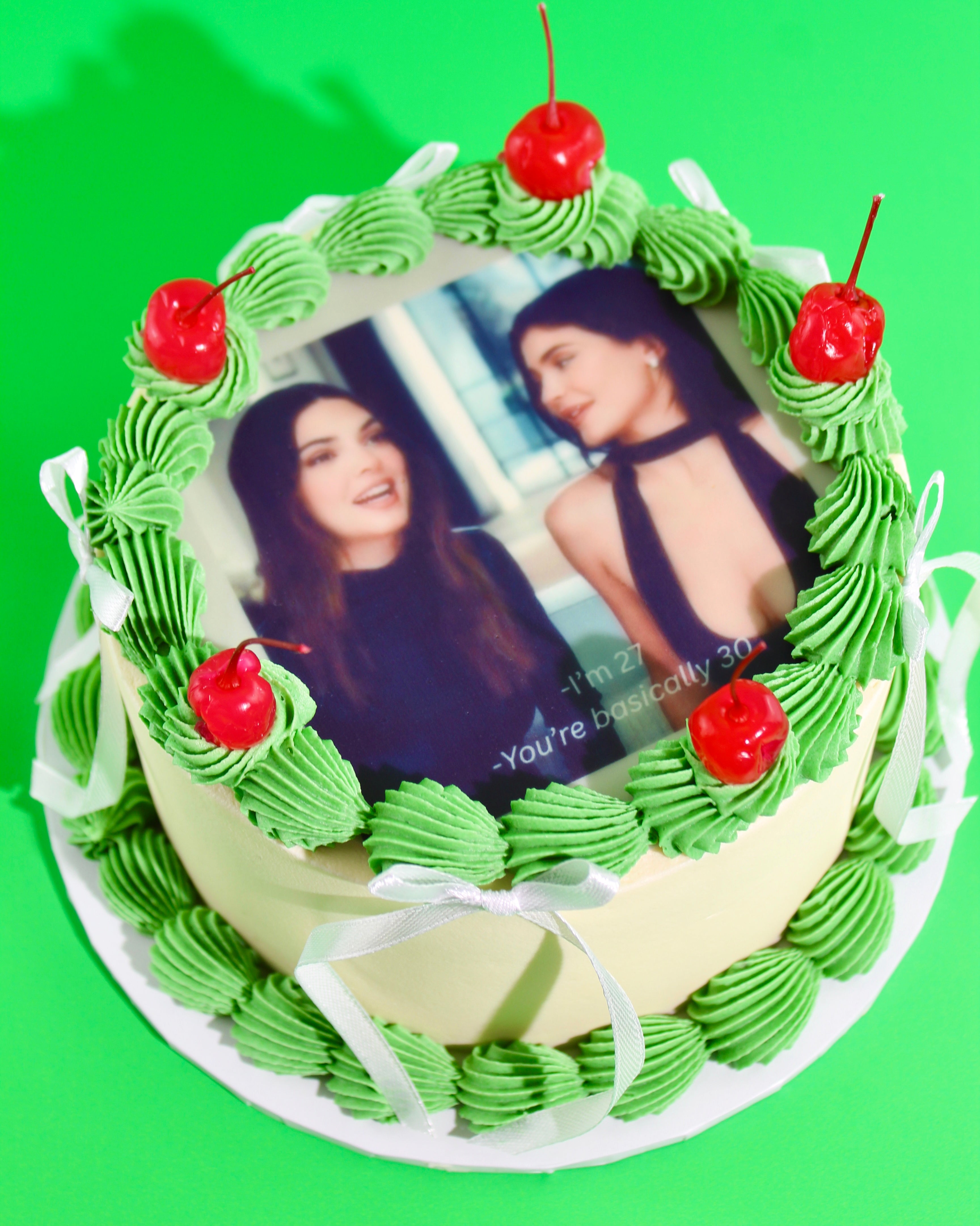 Funny meme birthday cake with green buttercream piping, cherries and personalised edible image.