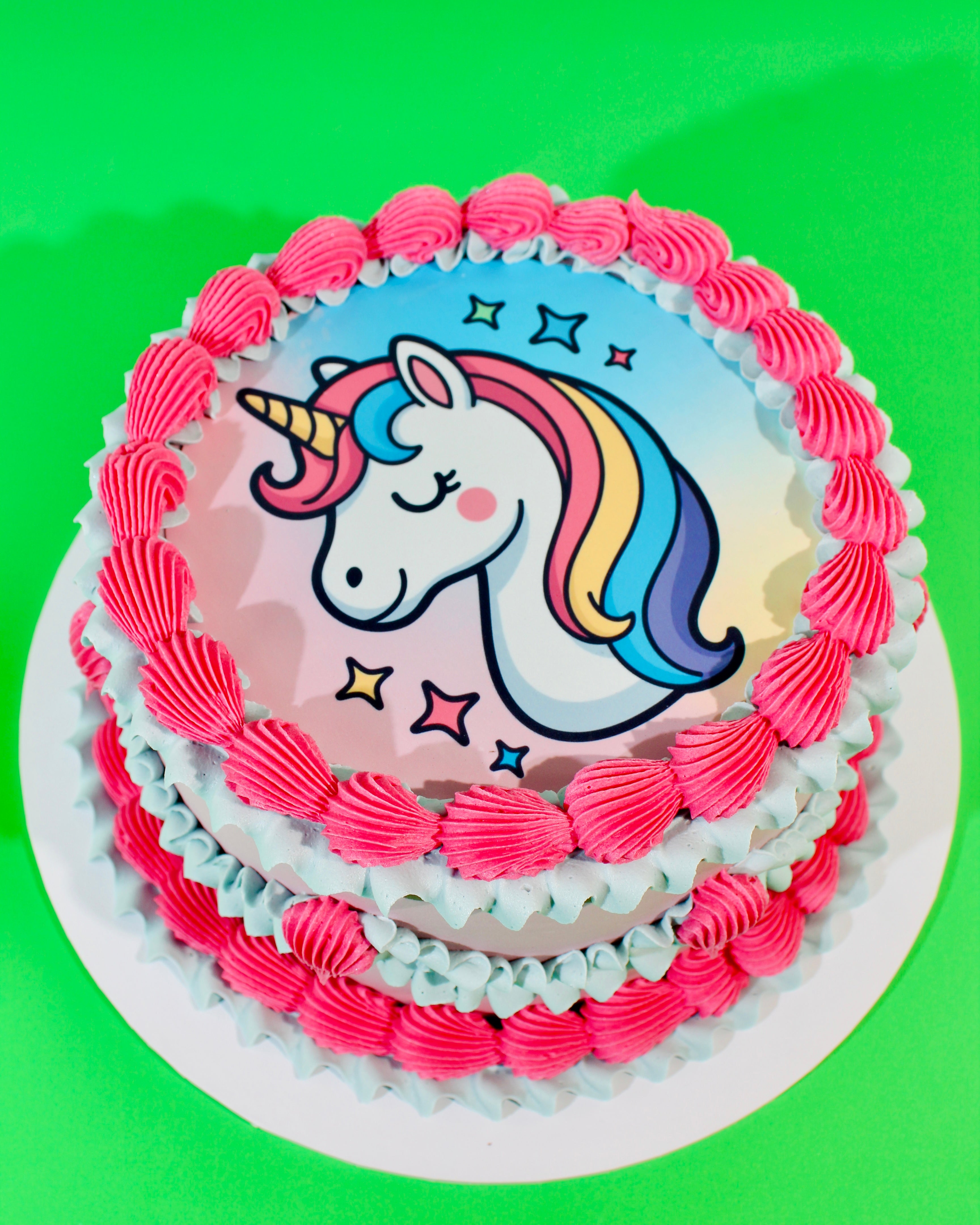 Unicorn Vintage Cake with pastel unicorn design and retro pink and blue buttercream piping