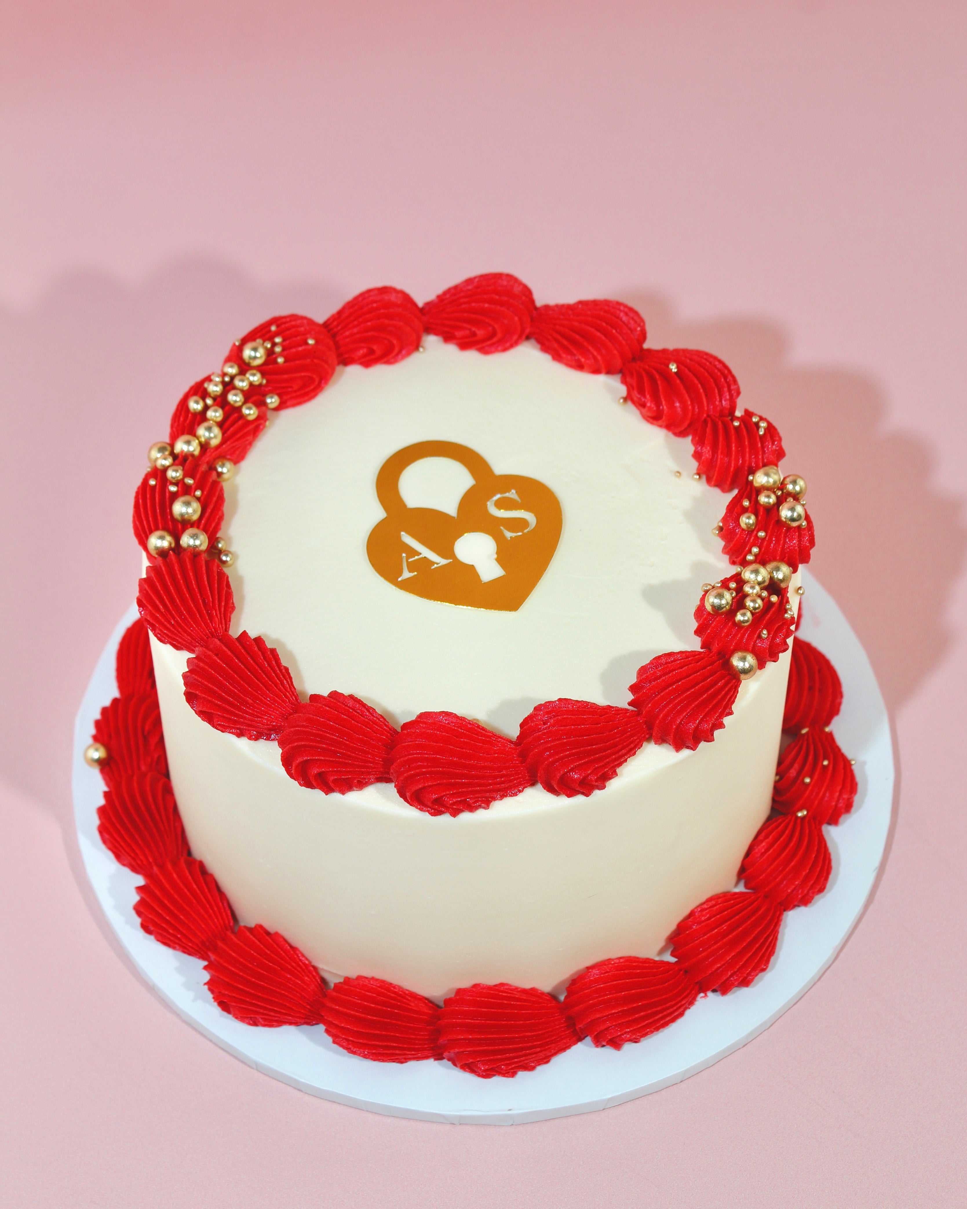 Luxury Valentine’s cake with heart locket design, London delivery available.
