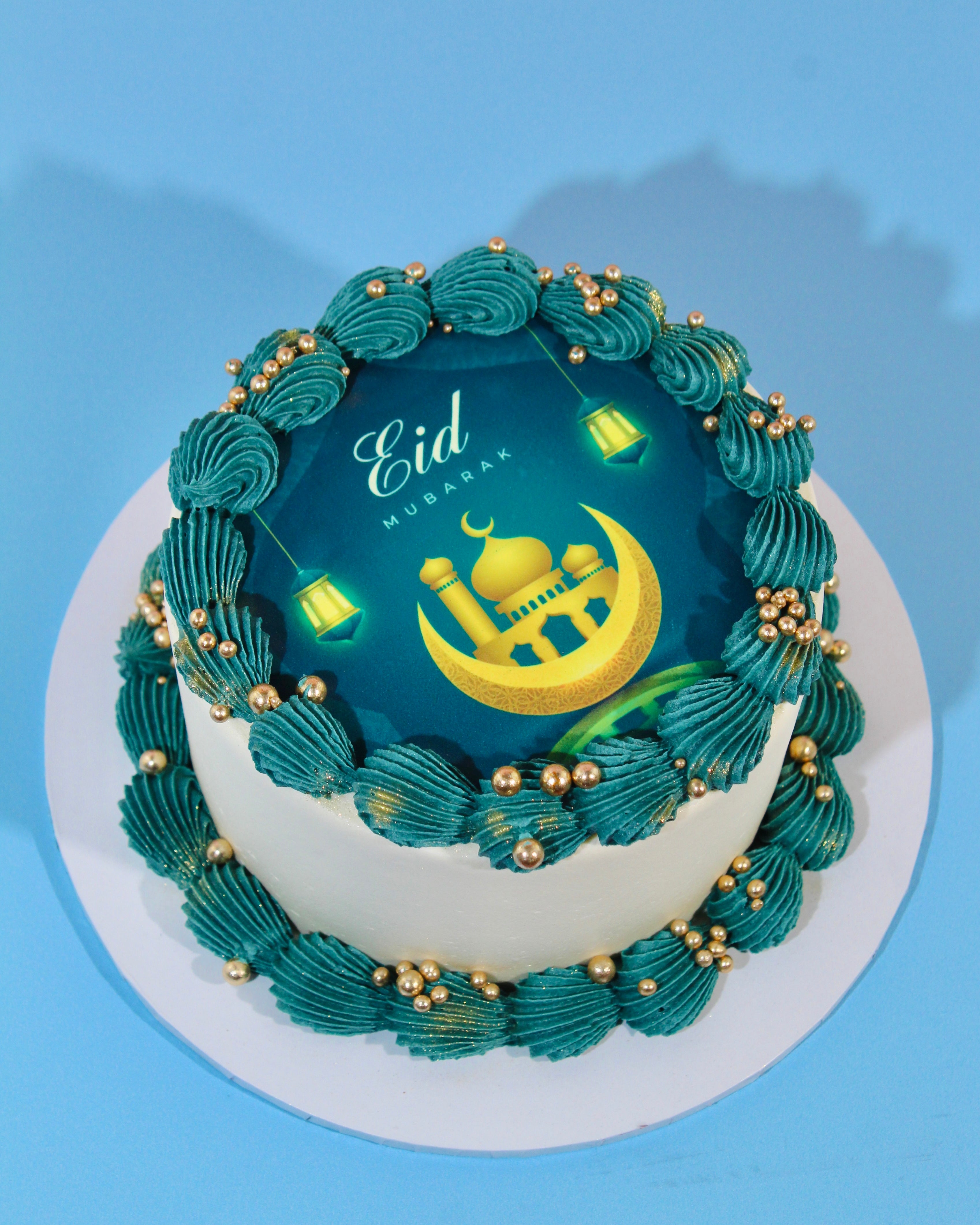 Eid Mubarak celebration cake with teal buttercream piping and gold details