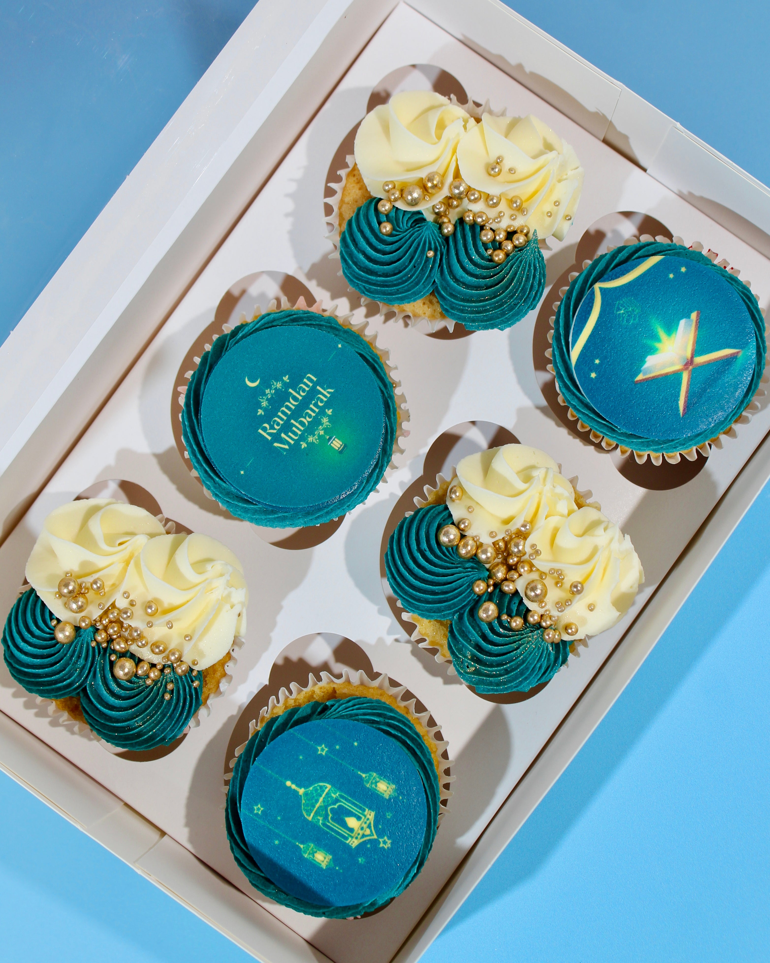 Luxury Ramadan cupcakes with teal buttercream, gold sprinkles and Ramadan Mubarak edible toppers