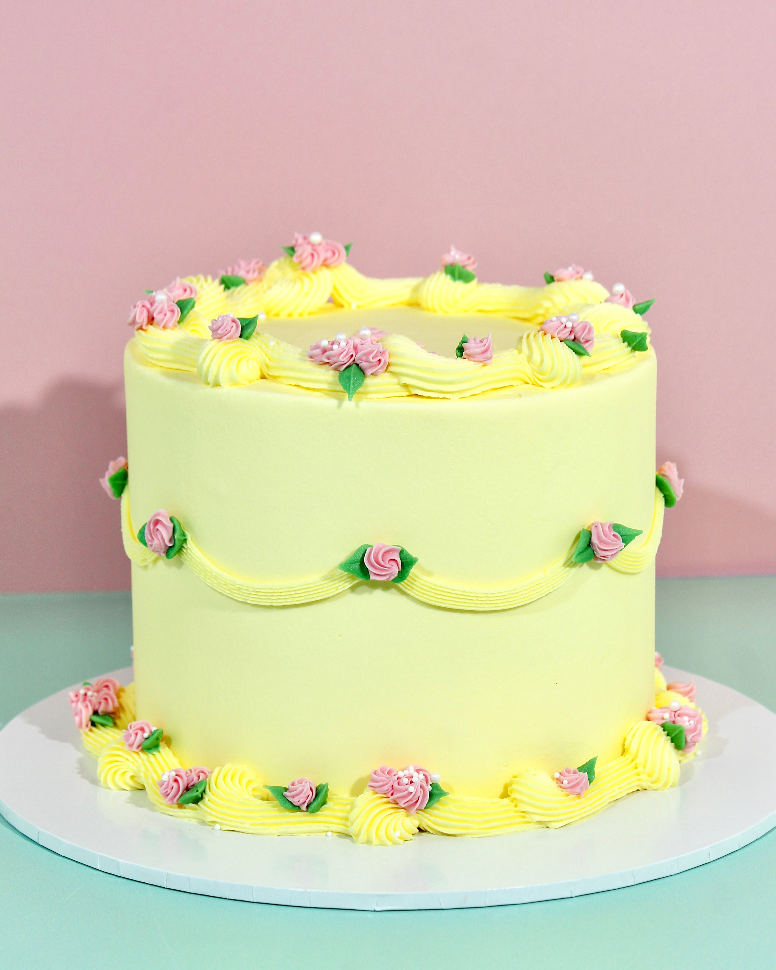 Vintage style cake with buttercream swirls and flower details