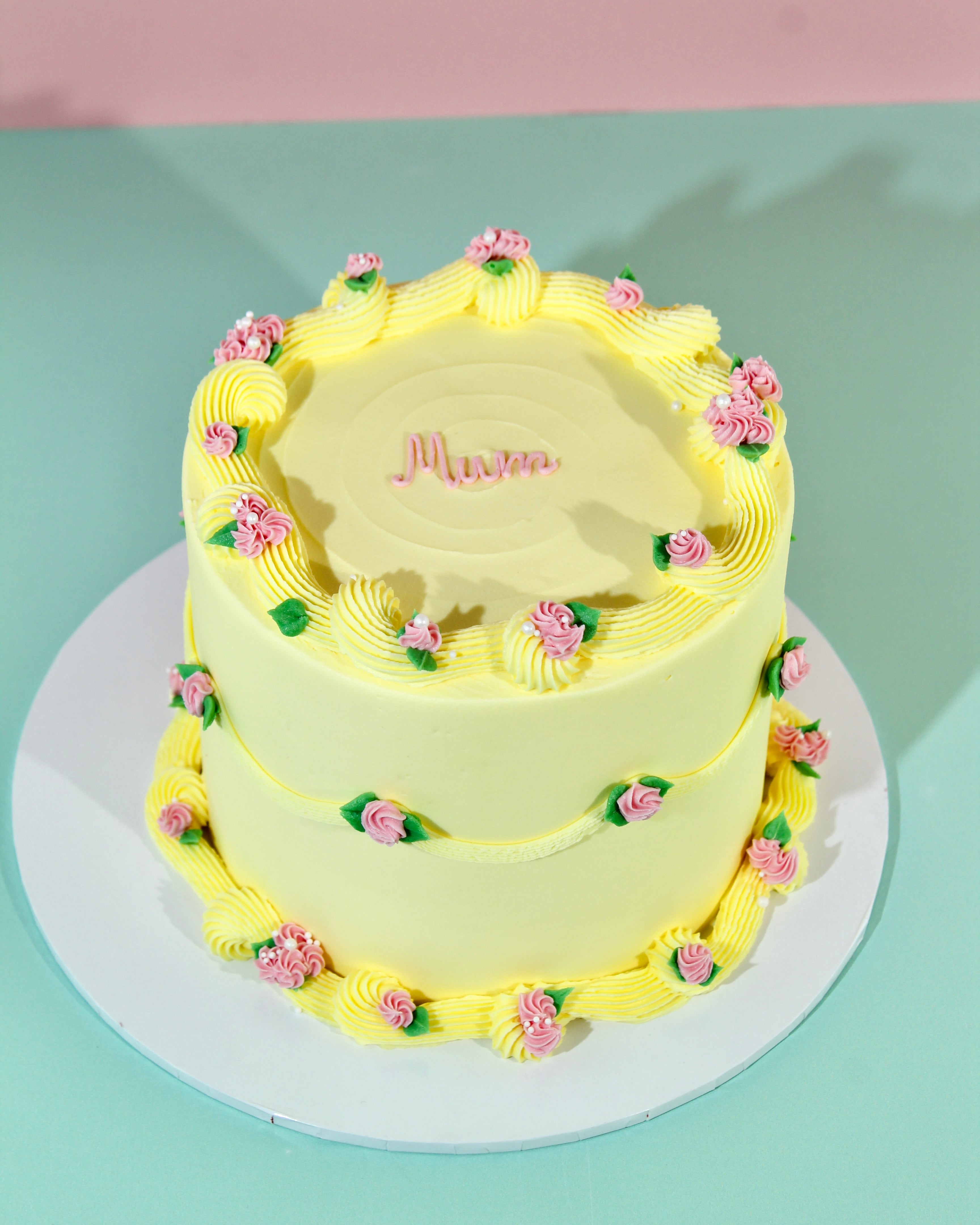 Custom floral cake with piped rose decorations