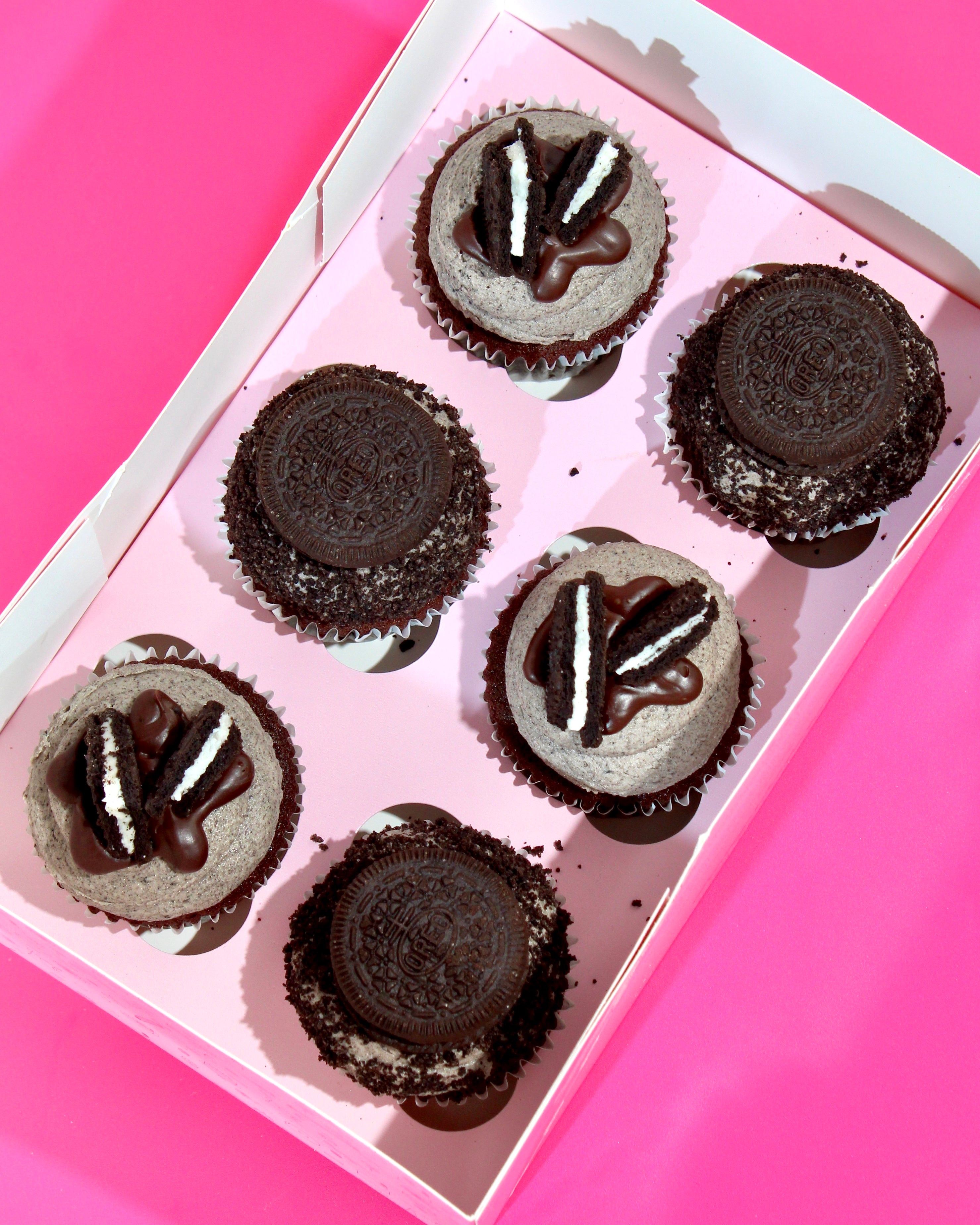Oreo cookies and cream cupcakes with chocolate drizzle and biscuit topping