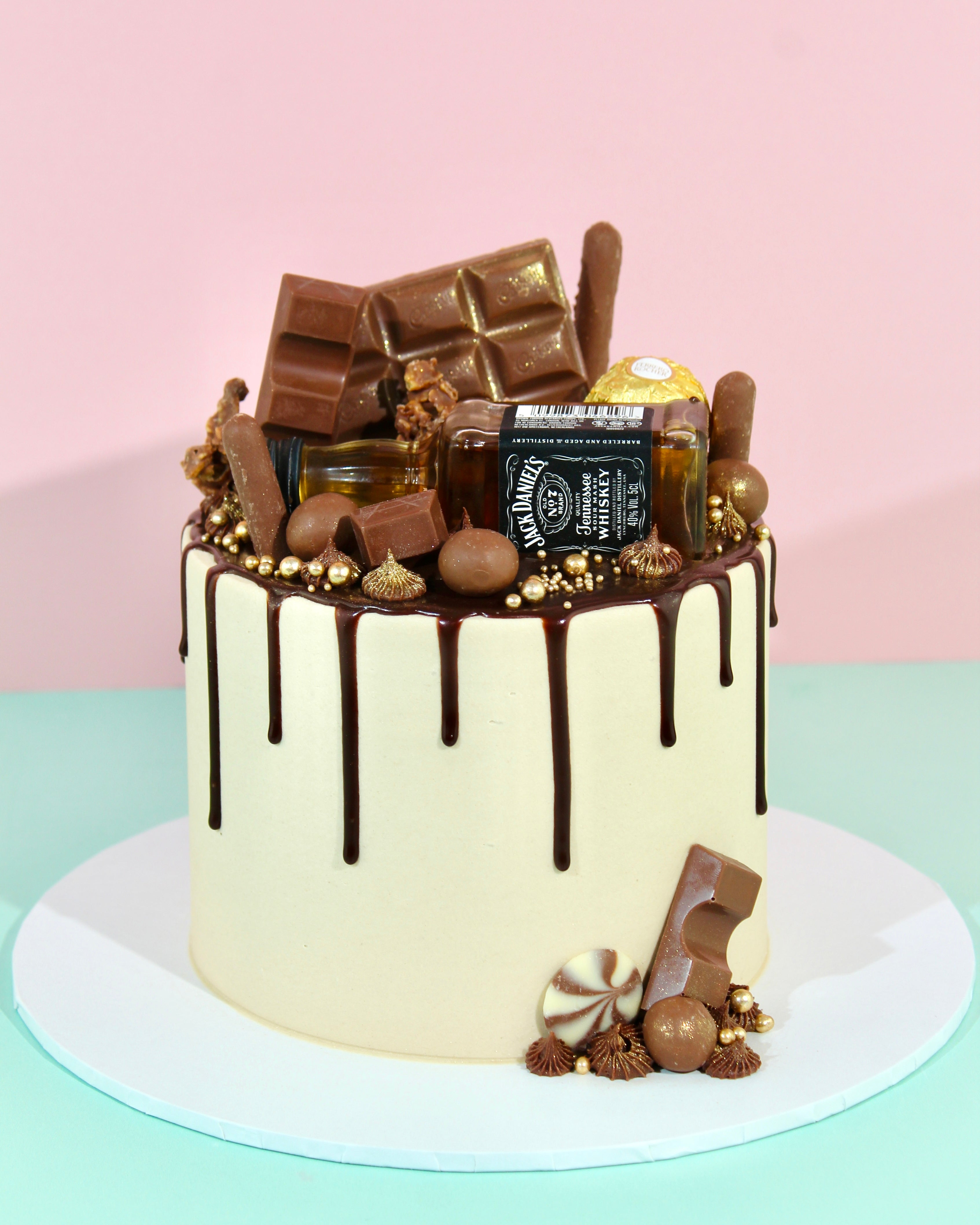 Mini alcohol Father’s Day cake with whisky bottle
