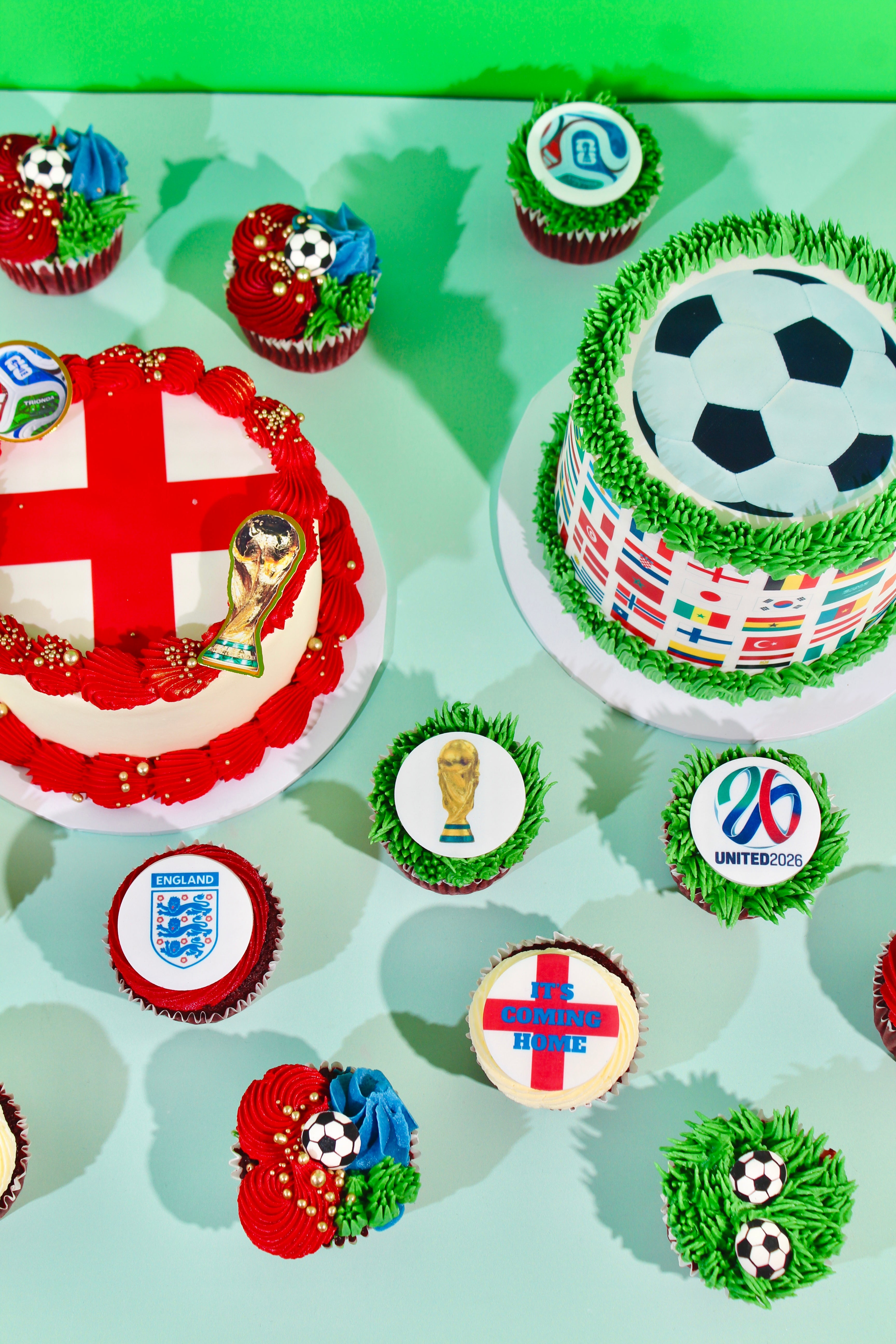 Mini England cake with St George's Cross top, red buttercream rosettes and gold pearl sprinkles