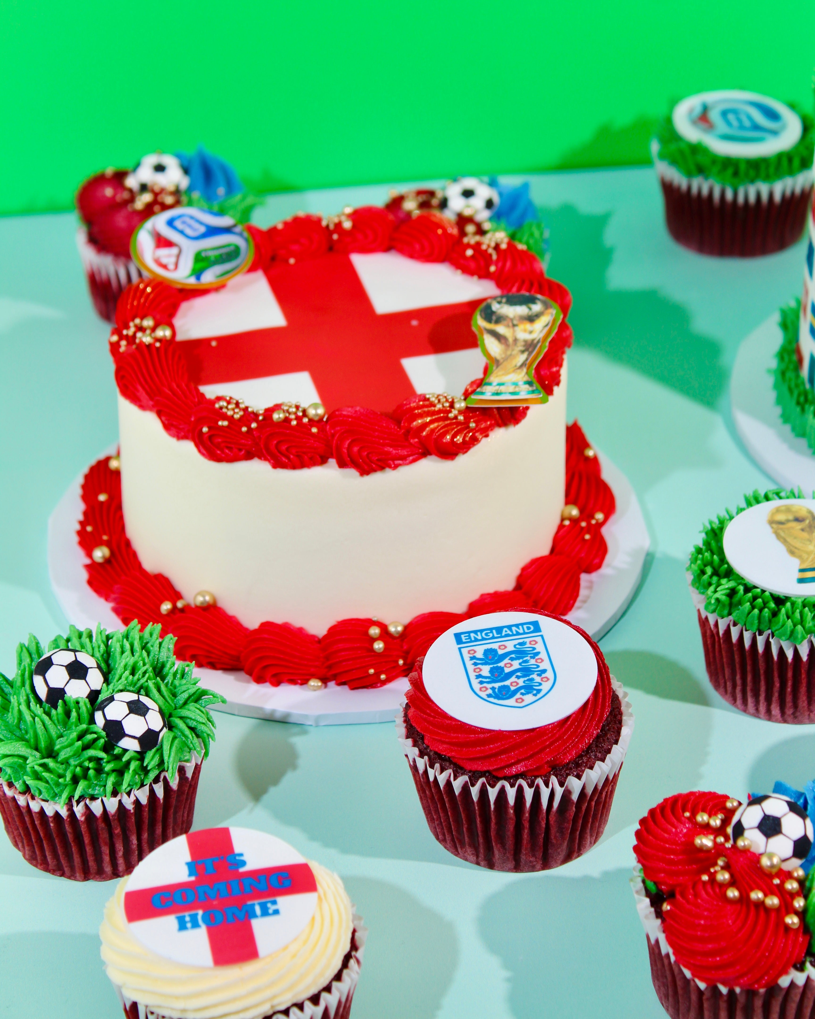 England World Cup cake surrounded by football cupcakes as a match day celebration centrepiece