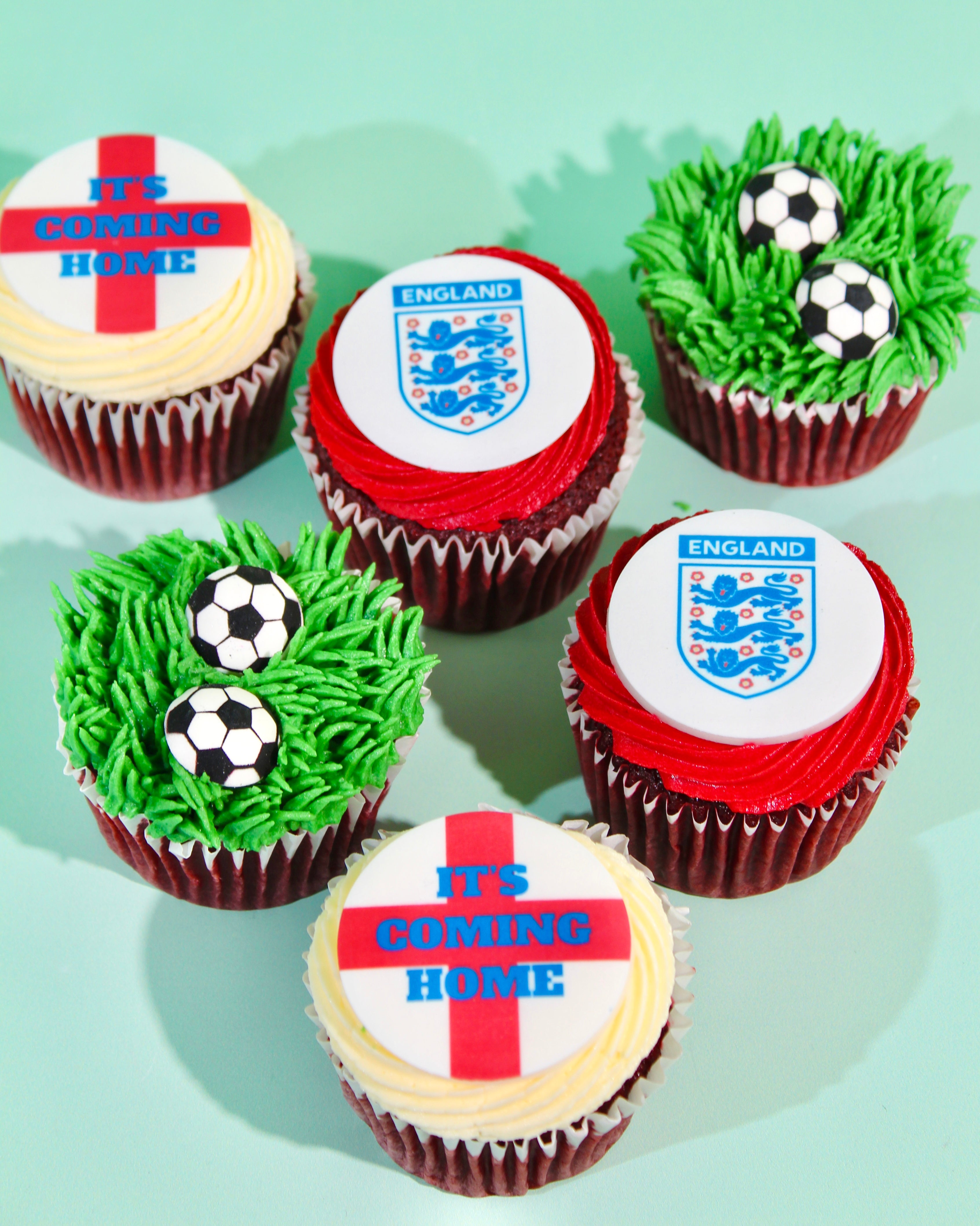 Box of six England World Cup cupcakes with St George's Cross, Three Lions badge and football grass designs