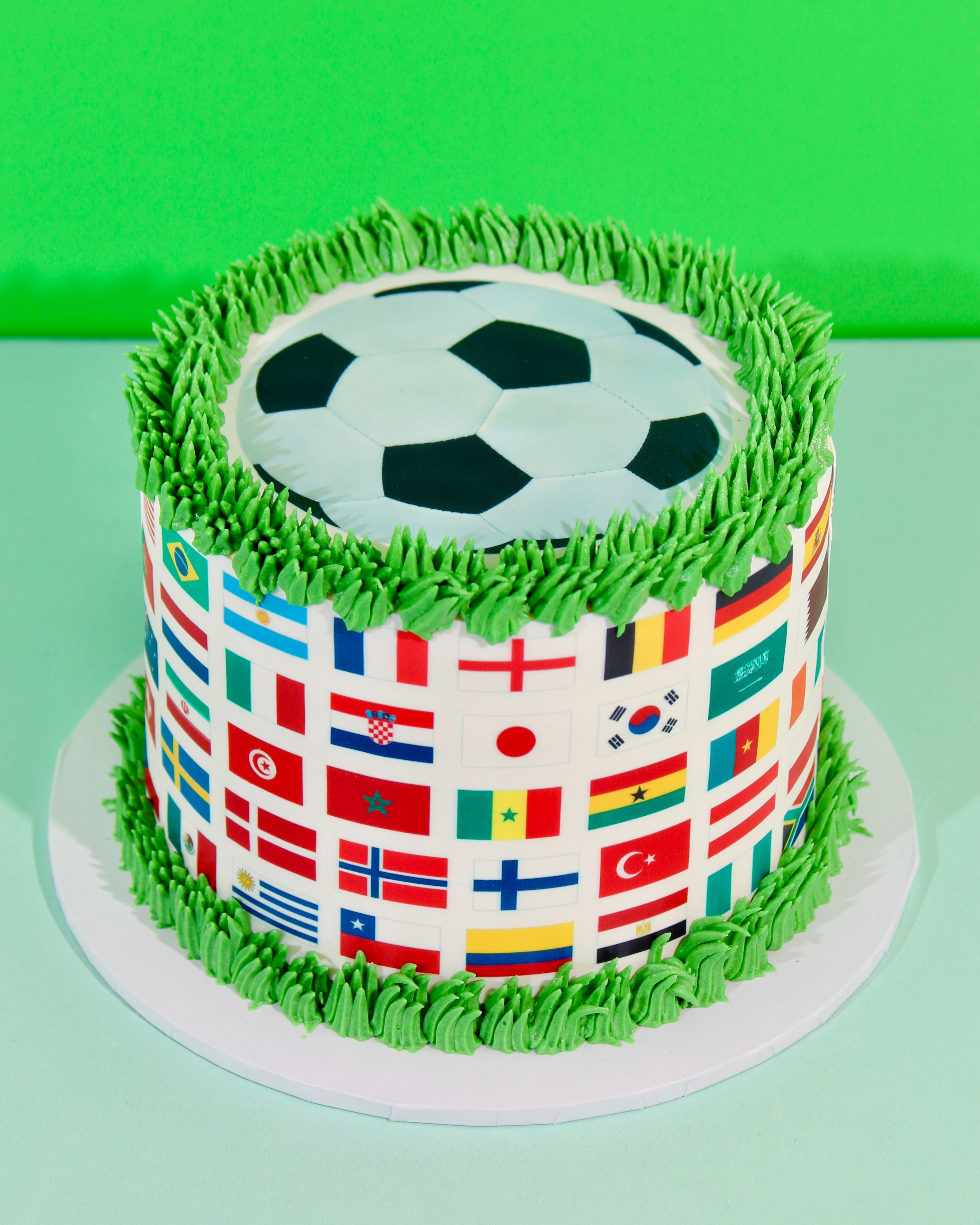 Football nations cake surrounded by World Cup cupcakes as a watch party centrepiece
