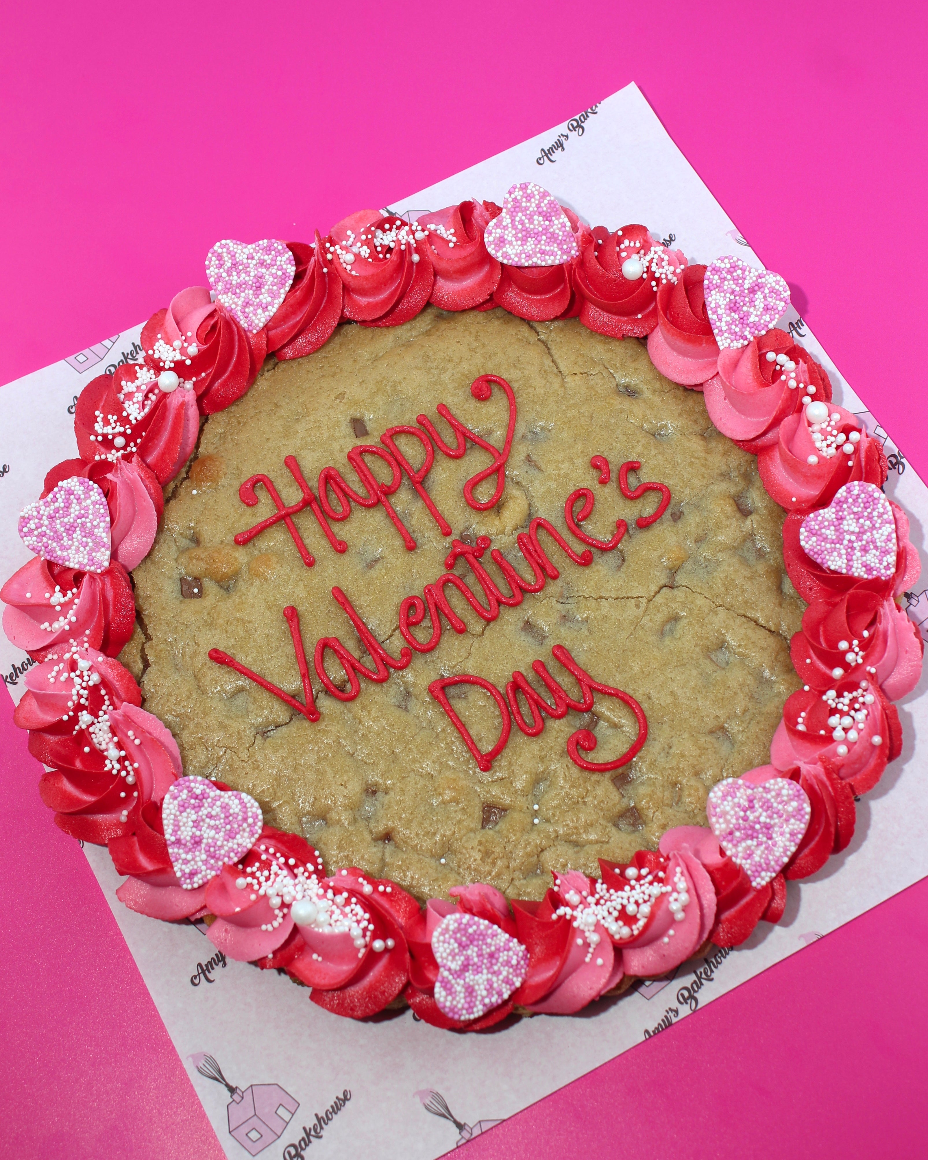 Personalised Valentine’s Day giant cookie decorated with hearts and buttercream