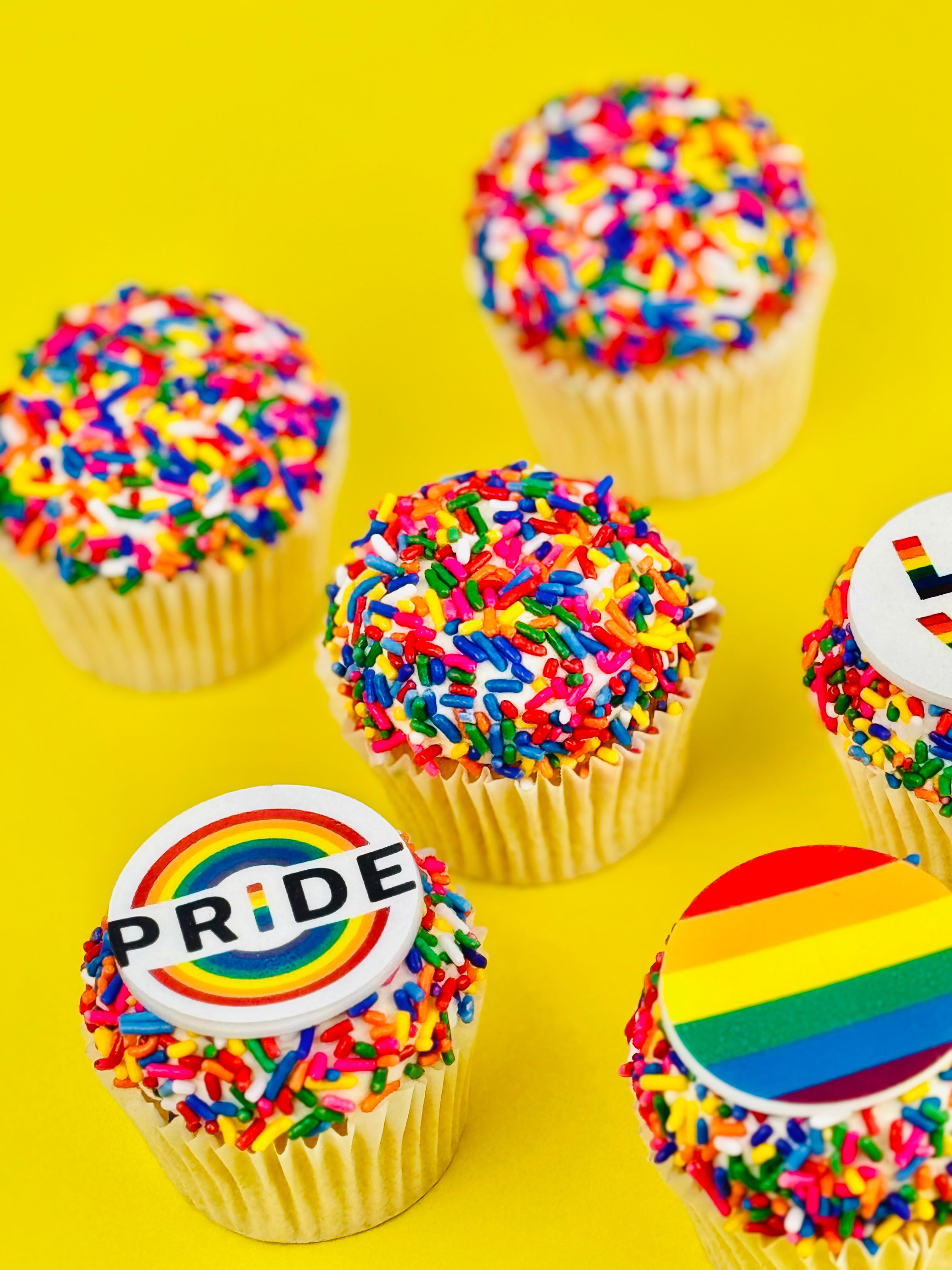Rainbow cupcakes with Pride love and rainbow disc toppers